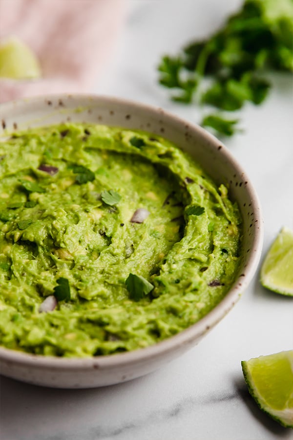 Guacamole prepared in bowl on counter