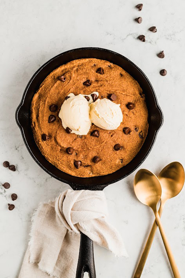 The pumpkin chocolate chip cookie skillet topped with ice cream.