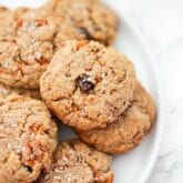 A white plate filled with carrot cake cookies.