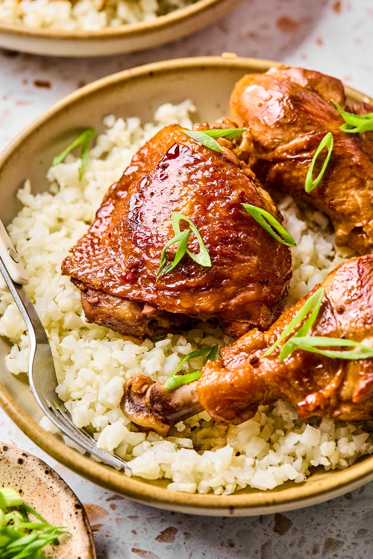Filipino chicken adobo over a bed of cauliflower rice.