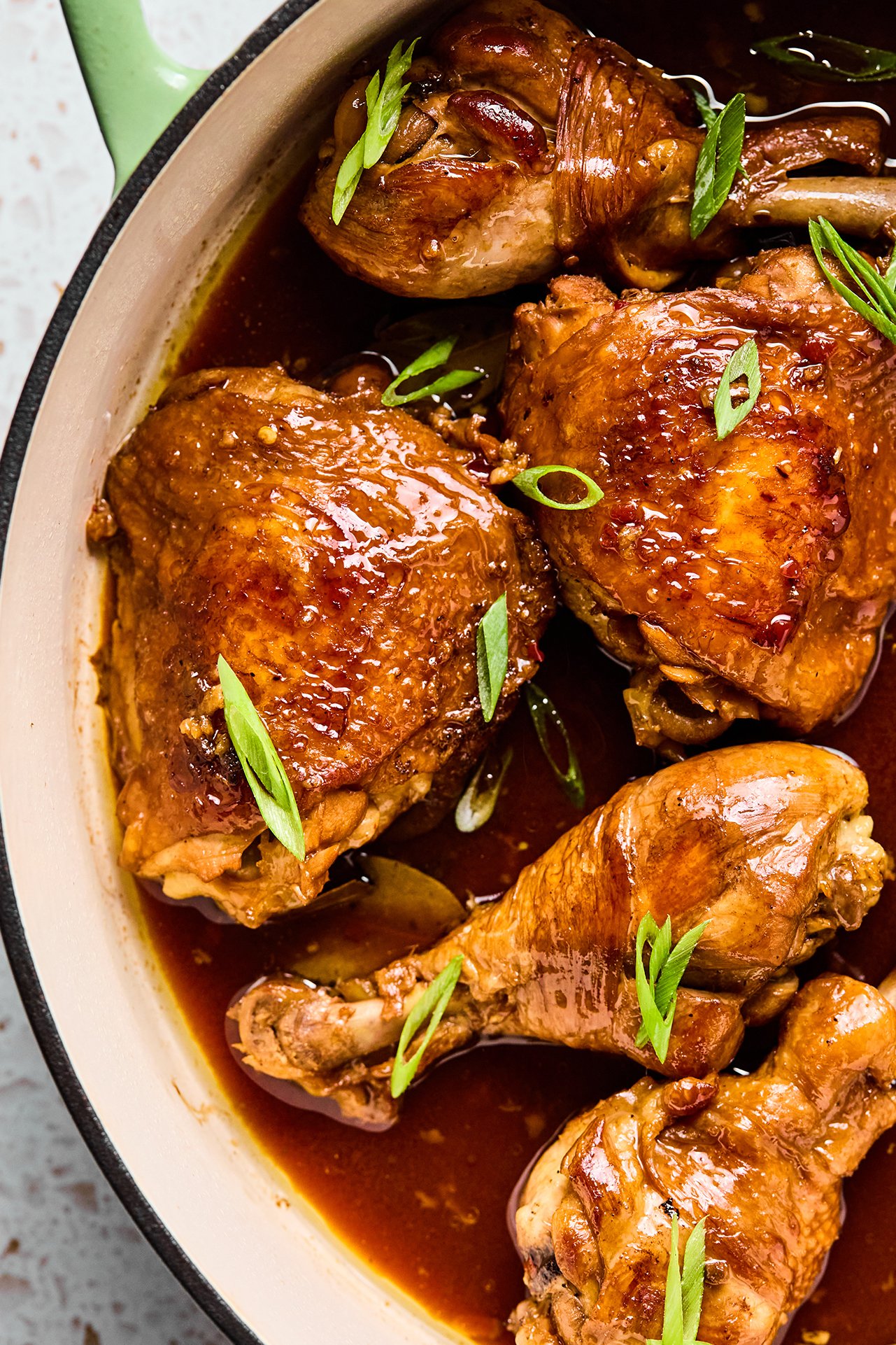 Filipino chicken adobo in a large cast iron pan.