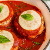 A dish with chicken parm burgers after being cooked before being served.