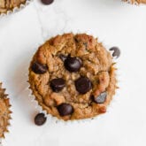 A zucchini chocolate chip muffin with extra chocolate chips.