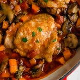 A cooking dish with chicken cacciatore in it after it finishes cooking.