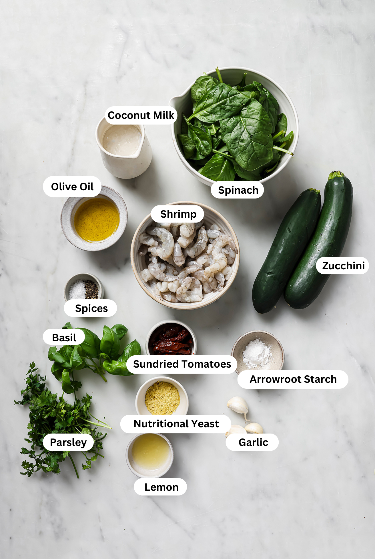 All the ingredients to make Tuscan Garlic Shrimp laid out in bowls before cooking.