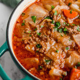 A Dutch oven filled with cabbage roll soup after cooking before being eaten.