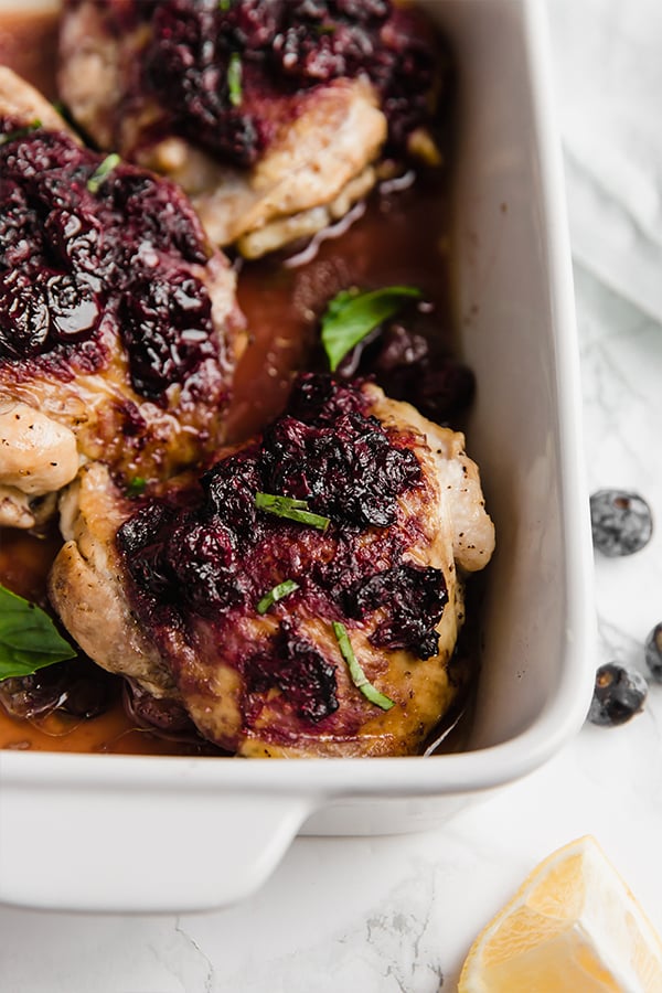 Blueberry balsamic chicken thighs in baking dish
