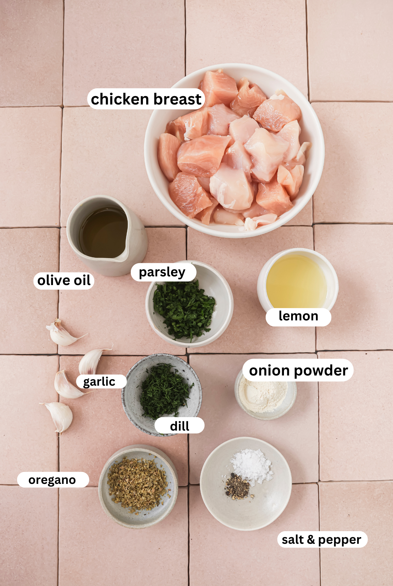 Chicken souvlaki ingredients in separate bowls.
