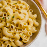 A white bowl filled with AIP mac and cheese.