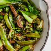 A baking dish filled with ginger beef stir fry after cooking.