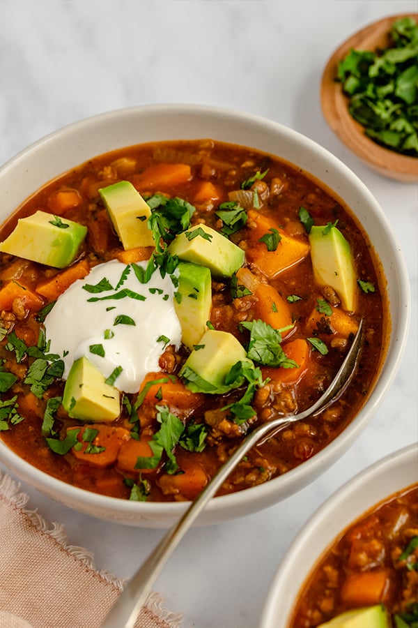paleo pumpkin chili in bowl with spoon