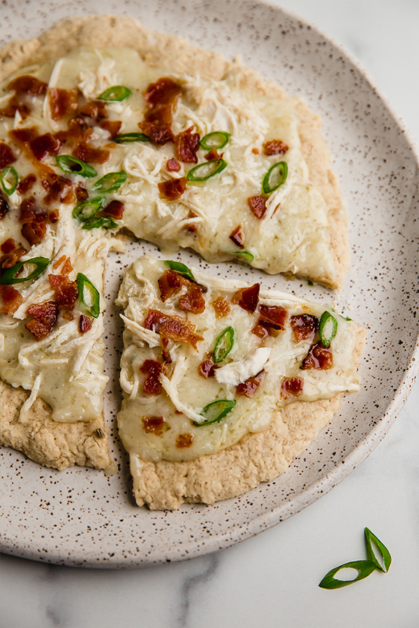 bacon ranch pizza slice on a plate