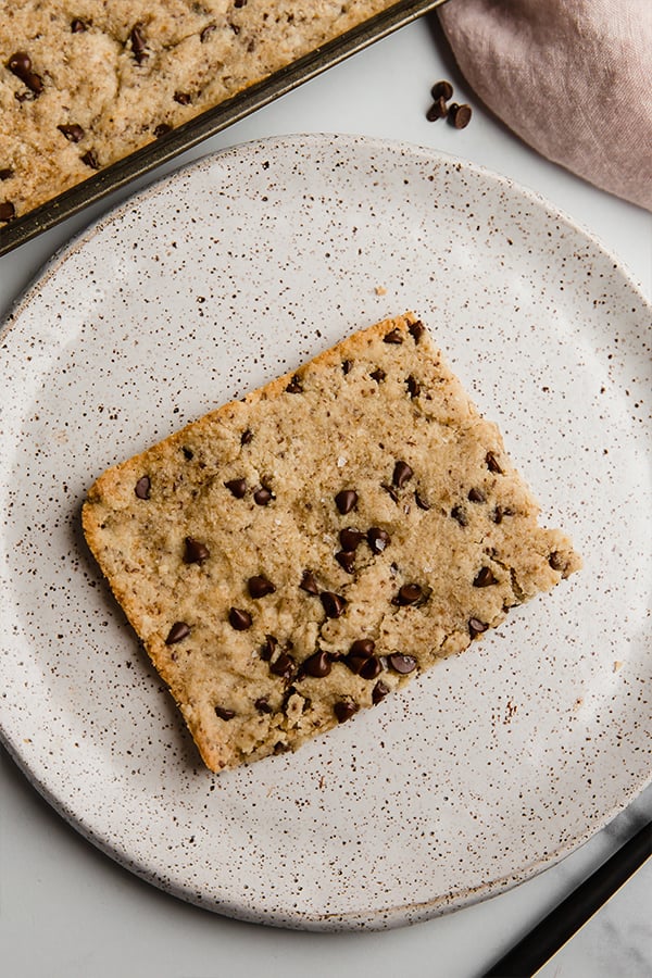 slice of sheet pan chocolate chip cookie on plate