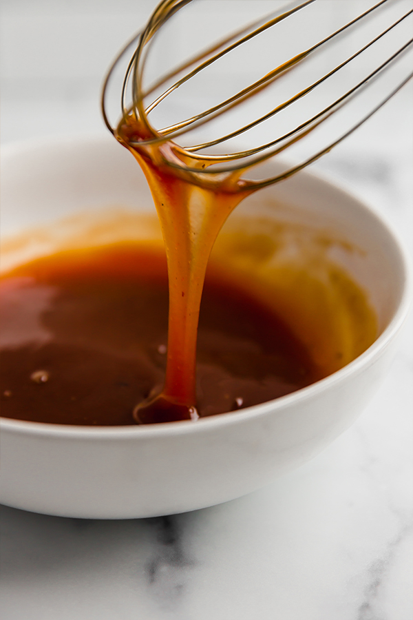 sweet and sour sauce with whisk