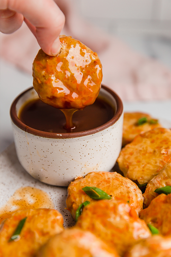 chicken poppers dipped in sauce