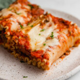 Plate of lasagna roll ups.
