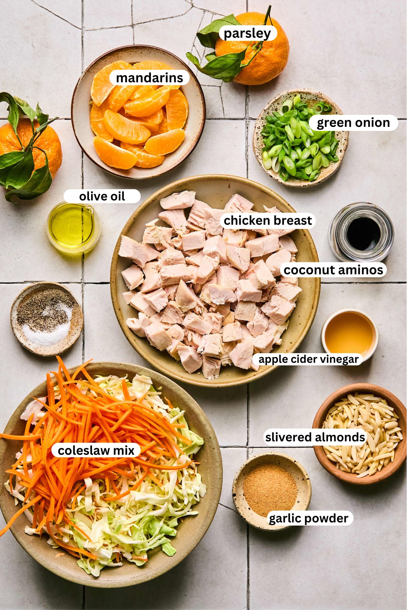 all ingredients for chinese chicken salad, separated in bowls