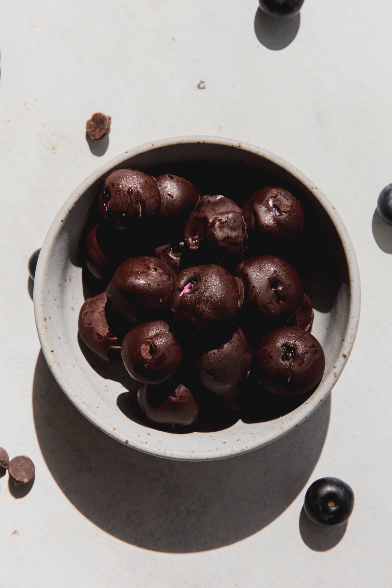 Chocolate yogurt frozen blueberries in a bowl.