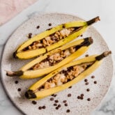 Three campfire bananas on a plate.