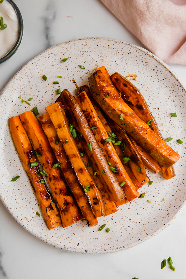 Sweet potato fries grilled and served on a plate