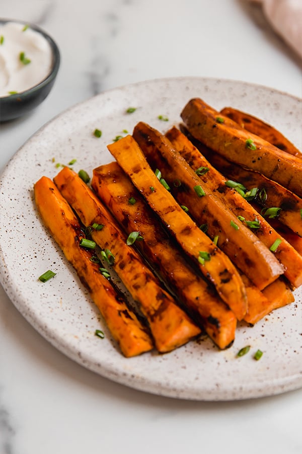 Sweet potato fries grilled and served on a plate