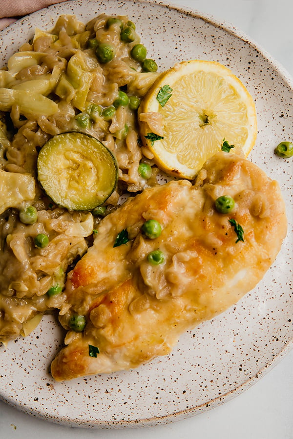 Lemon chicken with orzo served on a plate
