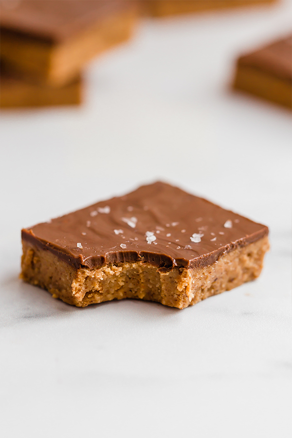 Almond butter bar with bite in the corner