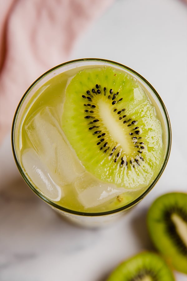 Kiwi refresher in a glass with ice
