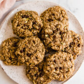 Chocolate chip oatmeal zucchini cookies on a plate.