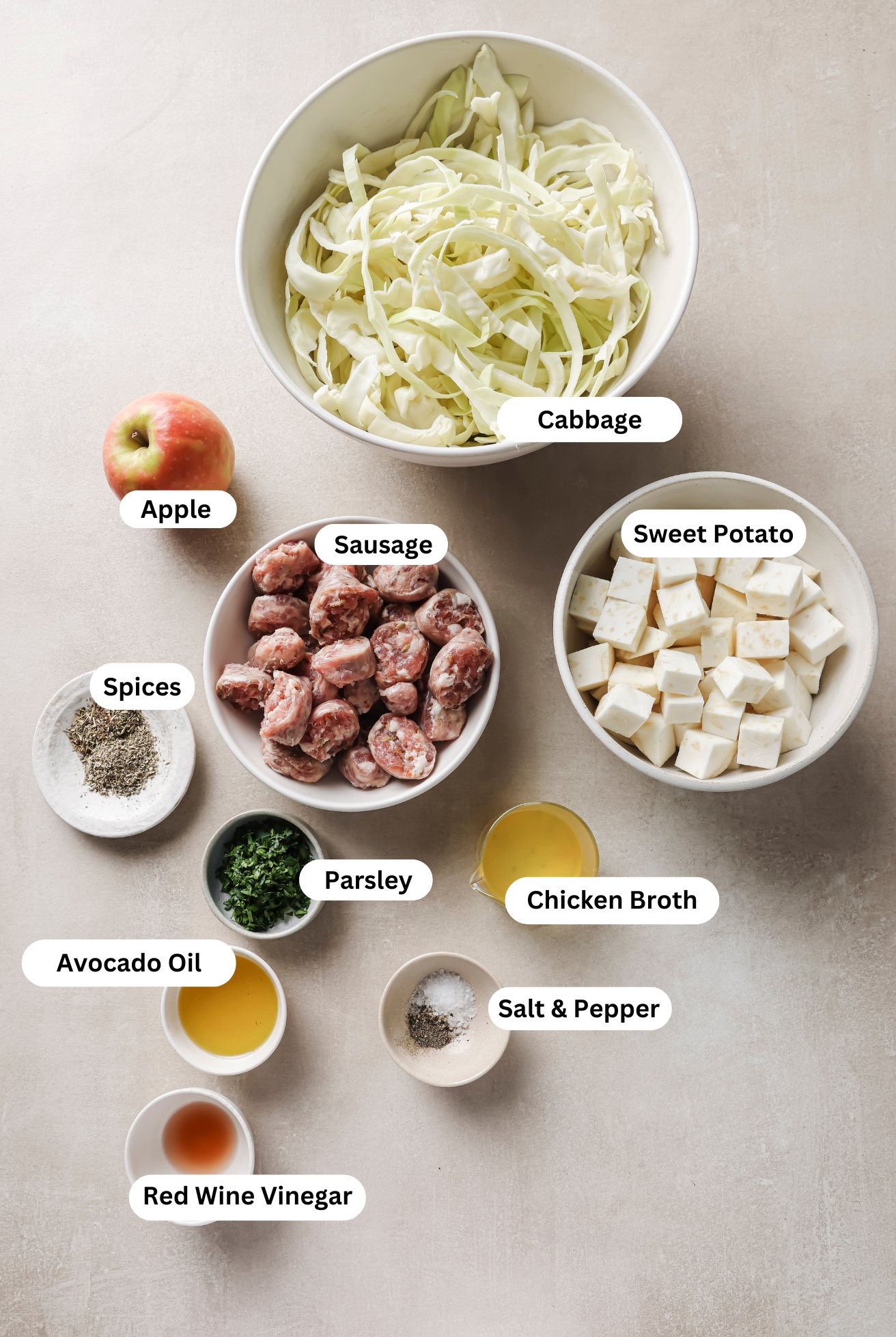 All the ingredients for cabbage and sausage breakfast skillet before cooking.