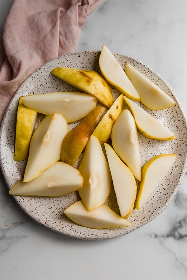 A plate of sliced pears.