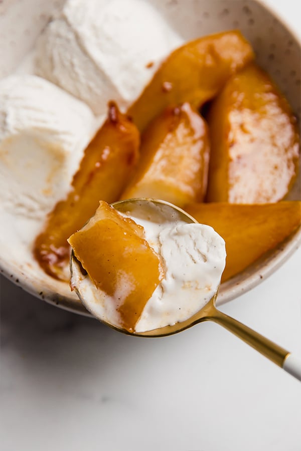 A bite of pear with ice cream.