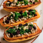 Stuffed Delicata squash on a plate.