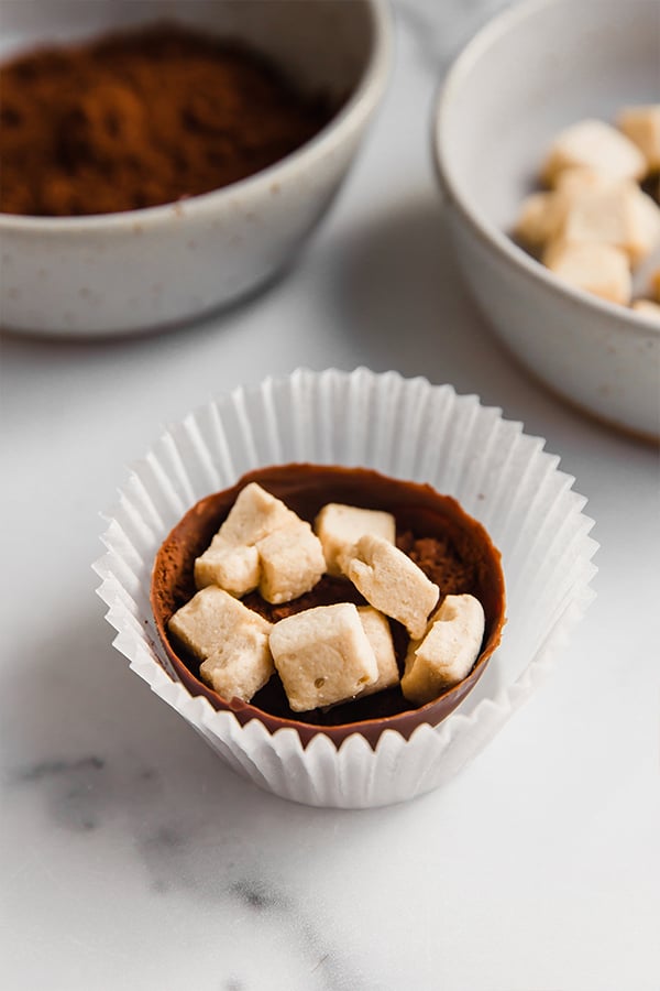 cocoa shells with hot cocoa mix and marshmallows