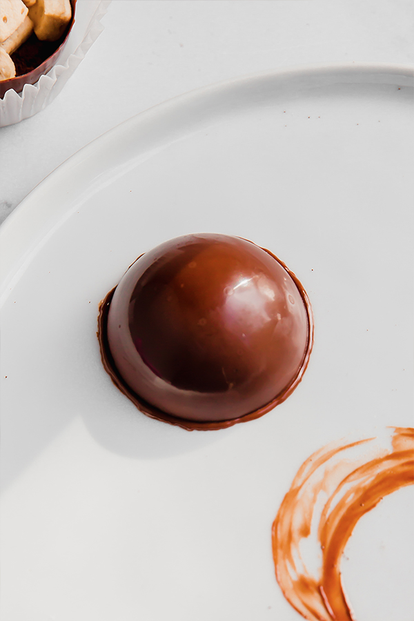 chocolate shell melting on a plate