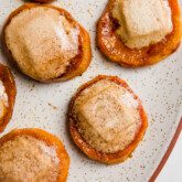 Sweet potato casserole bites with melted marshmallows on a plate.