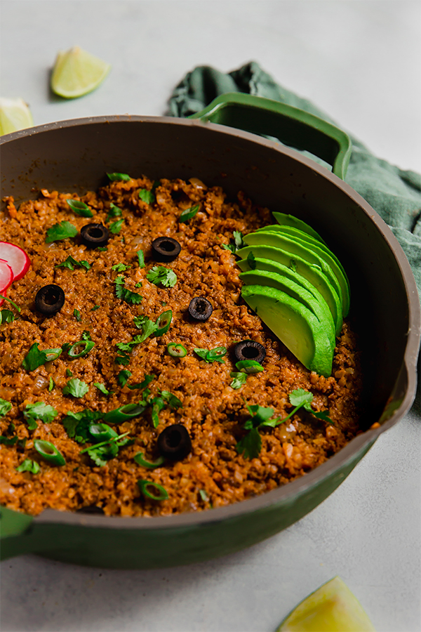 The ground beef enchilada in a skillet.