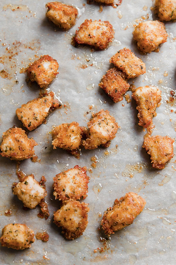 Pork panko chicken nuggets on a baking sheet after cooking.