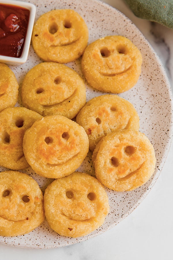 A plate of sweet potato smiley fries.
