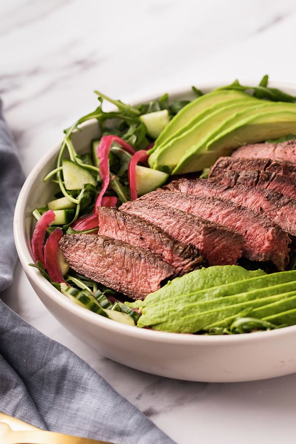 A bowl filled with balsamic steak salad.