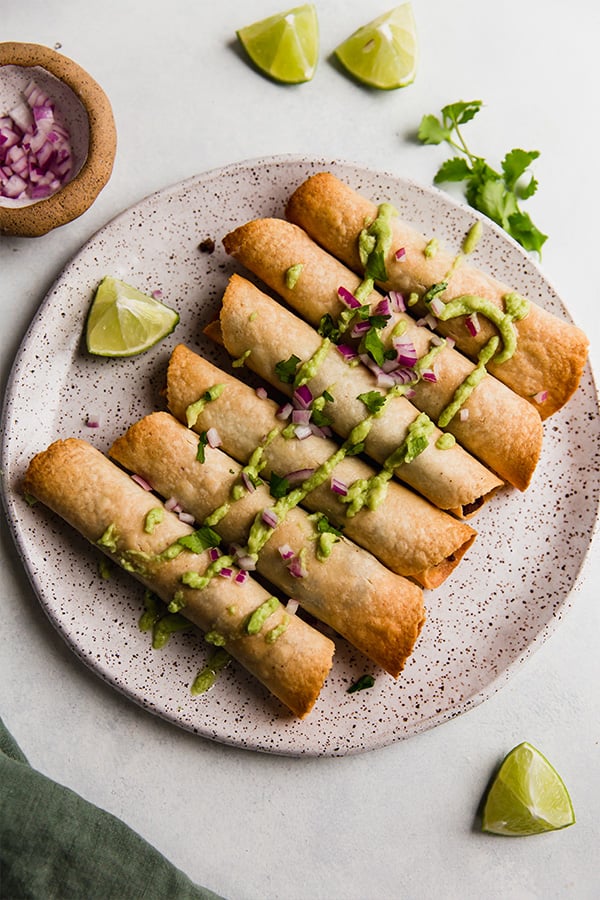 A plate of sweet potato and beef breakfast taquitos.