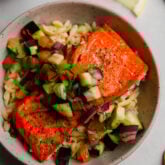 Salmon with Greek salsa over orzo.