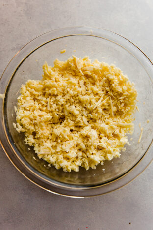 Shredded sweet potato mixture in a bowl.