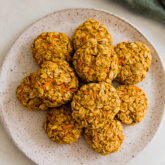Applesauce carrot cookies piled on a plate.