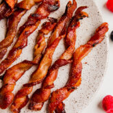 Oven bacon twists on a plate.