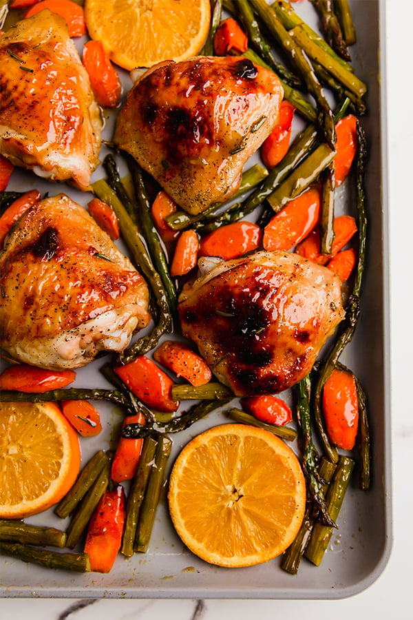 The one pan citrus glazed chicken on a sheet pan after cooking.