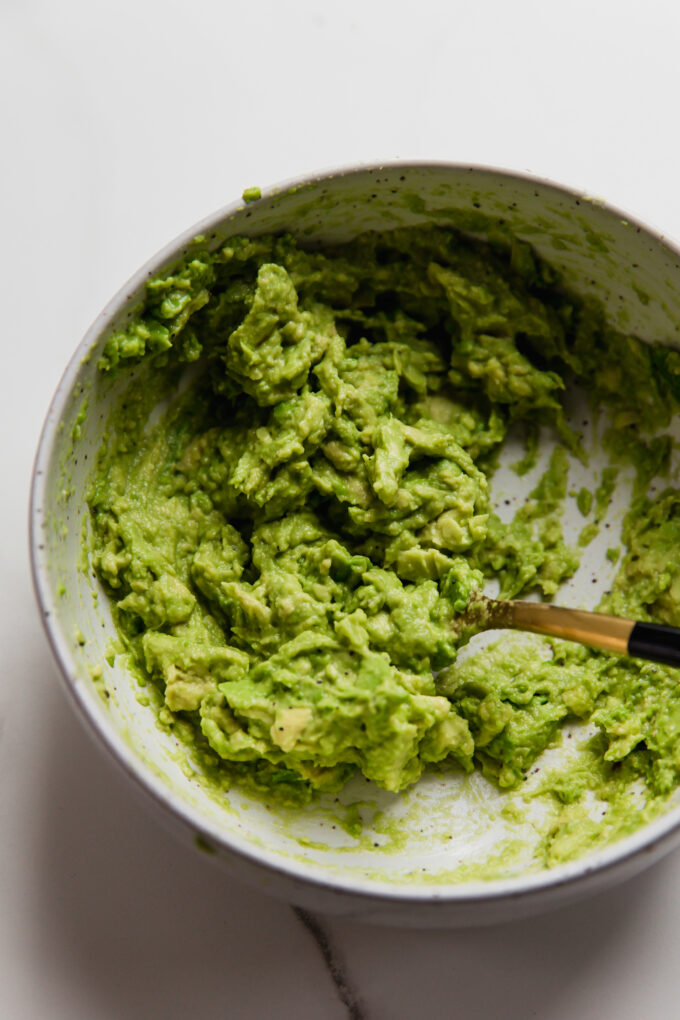 Mashed avocado mixture in a bowl.
