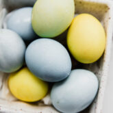 naturally dyed easter eggs in a carton