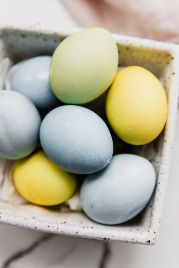 naturally dyed easter eggs in a carton