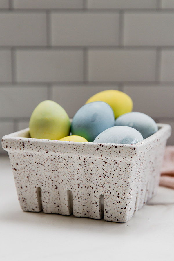 naturally dyed easter eggs in a carton